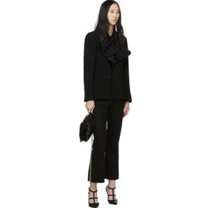 Alexander McQueen Kickback Jeans in Black. Size 25